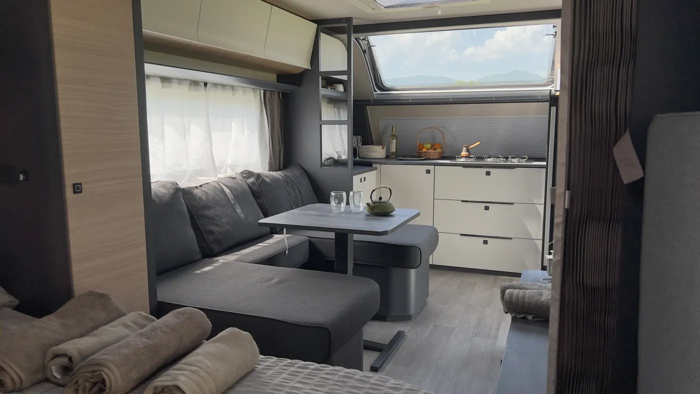 Sofa and dining area inside the caravan